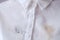 Close up of cosmetic stain on white shirt