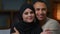 Close-up couple homeowners portrait multiracial ethnic family african american man hugging beloved arabian muslim woman
