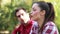 Close-up of couple singing and playing guitar in nature