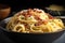 close-up of creamy bowl of spaghetti carbonara, with pepper and cheese visible