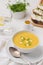 Close-up creamy squash soup in a white bowl