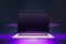 Close up of creative neon purple light gaming laptop with mock up place.