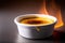 Close up of Creme Brulee with flame fire on it. French traditional cuisine.