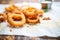 close-up of crispy onion rings on parchment