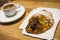 Close up of croissant with chocolate and coffee to breakfast - nobody at the photo - delicious croissant