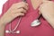 Close Up Crop Of A Young Female Doctor Holding A Stethoscope