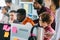 Close up cropped image of diverse office workers gathering in front of computers