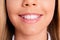 Close up cropped photo of charming lovely schoolgirl little lady mouth pink balm shiny toothy white smile teeth hygiene