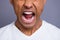 Close-up cropped portrait of handsome attractive crazy guy wearing white shirt shouting loudly blame over gray