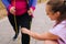 Close-up cropped shot obese overweight young woman doing exercises using fitness tape for weight loss with personal