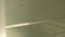 Close-up cropped shot of unrecognizable man cleaning inside of white modern refrigerator with steam cleaner at home in