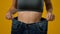 Close up cropped view unknown thin athlete girl unrecognizable slim slender sport woman lady female wearing old large