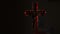 Close up of cross of jesus with blood lit by candle