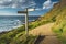 Close-up crossroad signpost. Ireland shoreline.