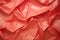 a close up of a crumpled red paper