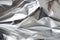 a close up of a crumpled silver foil