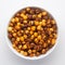 Close-Up of Crunchy Roasted Chana Masala in white Ceramic bowl, made with Bengal Grams or Chickpeas. Indian spicy snacks Namkeen