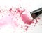 Close up of crushed blush on white background and cosmetic brush.