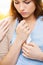 Close up of crying teenage girl and friend hand