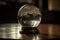 close-up of crystal ball, with light and shadows playing across the glass surface