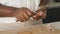 Close up of cuban woman hands peeling a raw garlic.