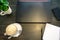 Close up cup of coffee, latte, laptop, phone and notebook for remote work on table in cafe with copy space
