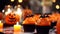 Close-Up Of Cupcakes And Pumpkin On Table During Halloween Celebration.