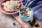 Close-up curd sweet dessert with fresh blueberries in blue deep bowl. Healty breakfast