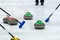 Close up of a Curling game situation.