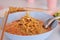 Close up Curried noodle soup with chicken or Khao Soi recipe. Traditional Thai food. Selective focus and shallow depth of field.