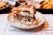 Close up cut half of Cheeseburger with grilled beef, feta cheese and sliced tomato served in white plate