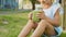 Close-up of cute little girl drinks a smoothies outdoor