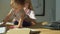 Close up of cute little girl sitting on the table