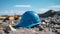 Close up of a cyan Working Helmet on Gravel. Blurred Construction Site Background