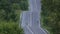 Close-up. Cyclists ride on a wet curved road