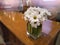 Close up daisy bouquet in vase on table for decorative room and interior,white flower in hotel reception area