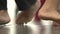 Close-up of dancer feet stepping on the floor. Low view