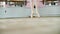 Close up, in dancing hall, ballerina performs pas courru , pointe , She is moving through the ballet class elegantly on