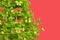 Close-up of decorated Christmas tree on pink background. 3D rendering