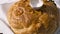 Close up of decorated fresh loaf with salt lying on the table, Ukrainian and Russian wedding traditions. Action. Wedding