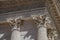 Close-up of decorative capital and frieze on the Maison CarrÃ©e`s columns, an ancient Roman temple, in Nimes.