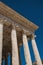 Close-up of decorative capital and frieze on the Maison CarrÃ©e`s columns, an ancient Roman temple, in Nimes.