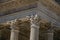 Close-up of decorative capital and frieze on the Maison CarrÃ©e`s columns, an ancient Roman temple, in Nimes.