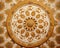 close up of a decorative design on a wallpapered surface with a circular design in the center.