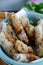 Close up deep fried corn spring rolls, delicious vegan food ready to eat