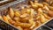 Close up of deep fried french fries for perfectly crispy texture and golden brown color