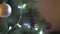 Close up defocus view on incredible Christmas tree decoration sparkling bright light in festive New Year Eve atmosphere