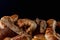 Close-up of delectable breads and baked goods on black background