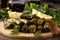 Close-up of delectable stuffed grape leaves with appetizing filling served on a rustic wooden platter garnished with lemon wedges