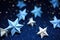 close-up of delicate origami stars on a night-blue background